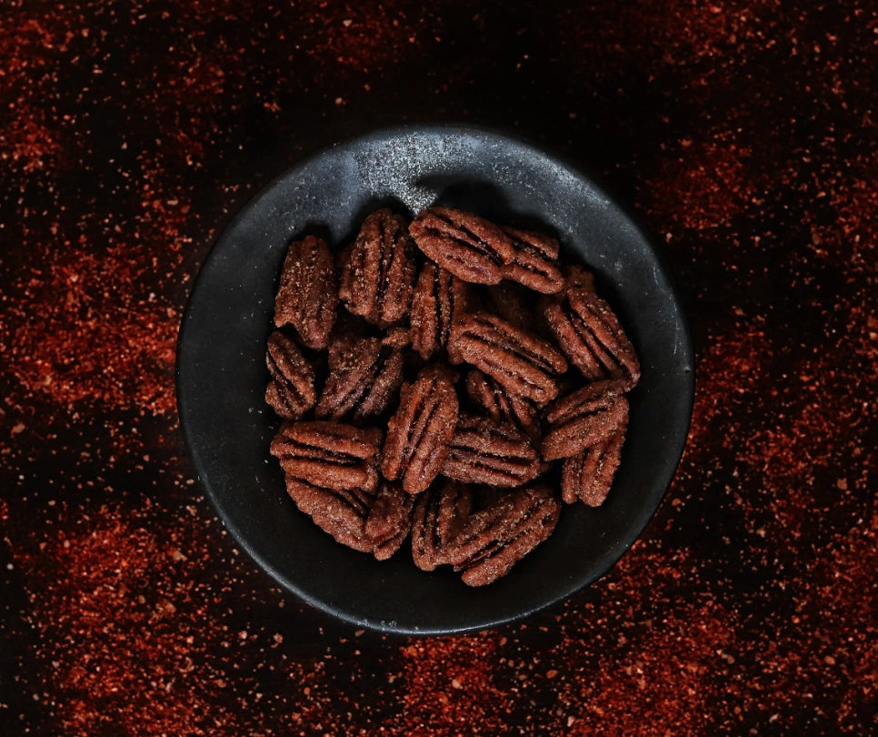 From Campanula Design Studio: Nutkrack is the ideal candied nut: sourced from the most delicious pecans, toasted to perfection, and just sweet & salty enough to bring out the mouth-watering, buttery flavor that already exists in pecans!