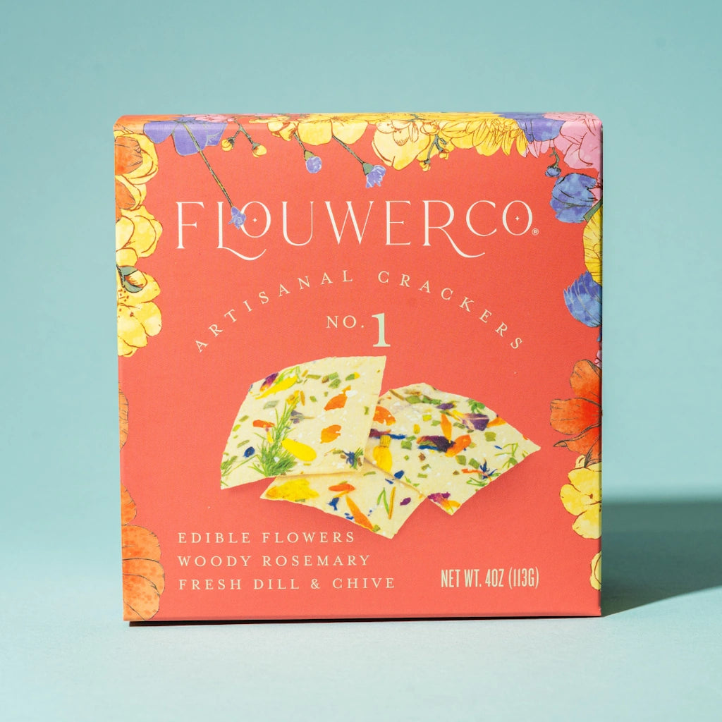 Flowerco crackers packaging with colorful design on a light blue background. Available from Campanula Design Studio, Seattle Florist and Luxury Gift basket company in the Magnolia Neighborhood.