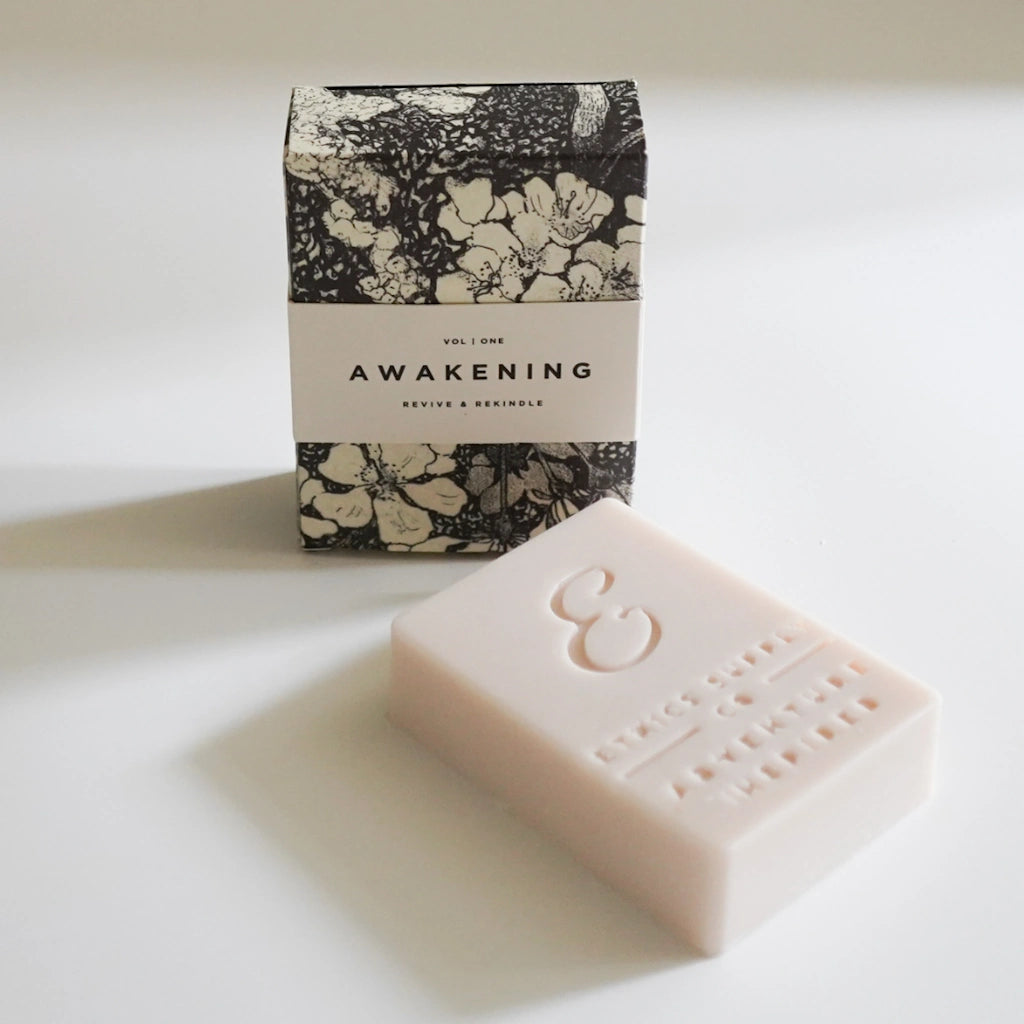 Bar of soap with 'Awakening' packaging on a light background