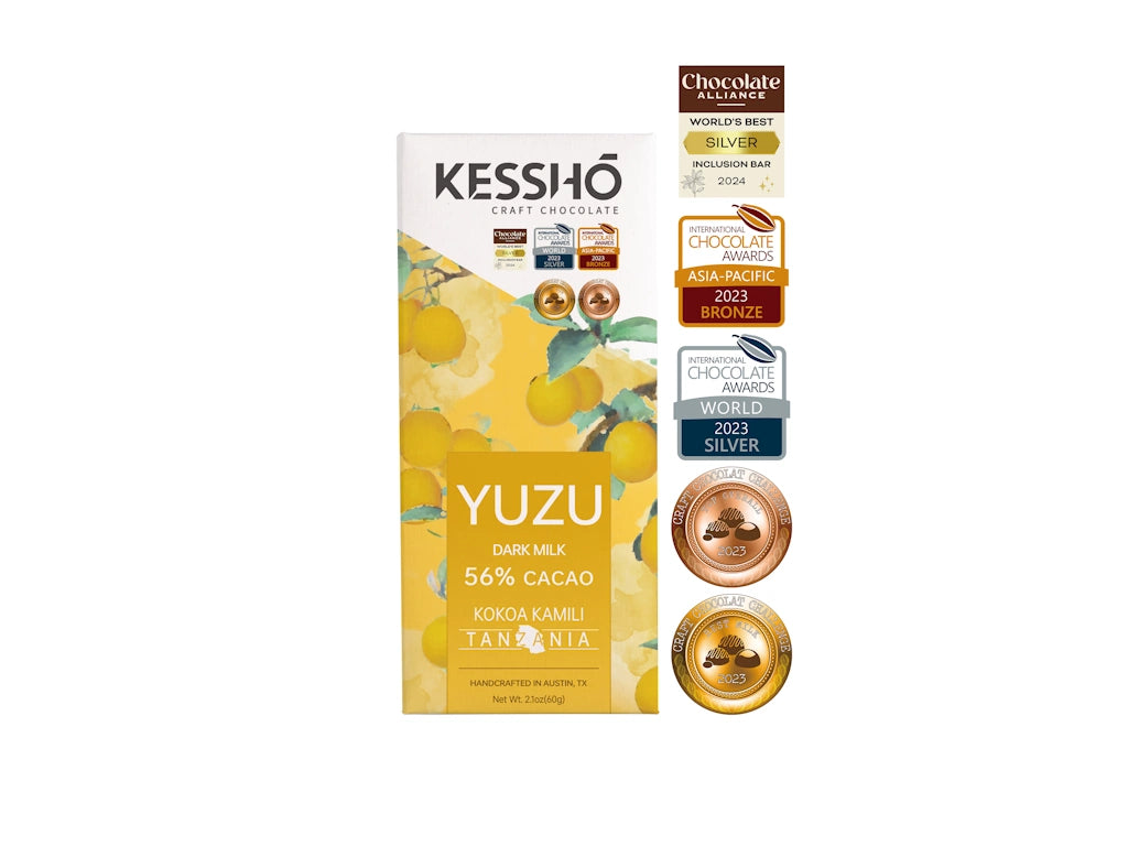 Kesshô Yuzu Dark Milk chocolate bar packaging with awards on a white background.  Available for sale from Campanula Design Studio, Seattle florist and gift basket company in the Magnolia neighborhood.