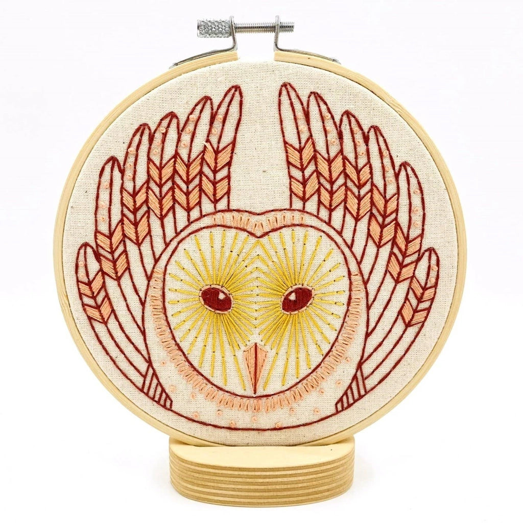 Embroidery hoop with owl design on a white background