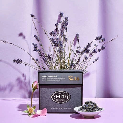 Smith Tea Black lavender tea with lavender flowers and a small bowl of tea leaves on a purple background.  Available for sale from Campanula Design Studio, Seattle florist and gift basket company in the Magnolia neighborhood.