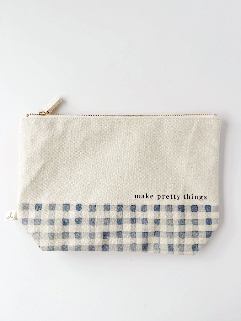 Pouch with blue checkered band and 'make pretty things' text on a white background.  Available for sale from Campanula Design Studio, Seattle florist and gift basket company in the Magnolia neighborhood.