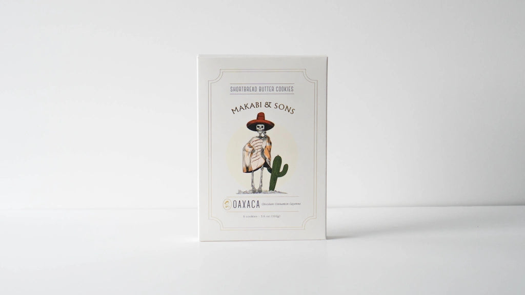 Shortbread cookie box with a skeleton in a hat and cactus illustration on a white background