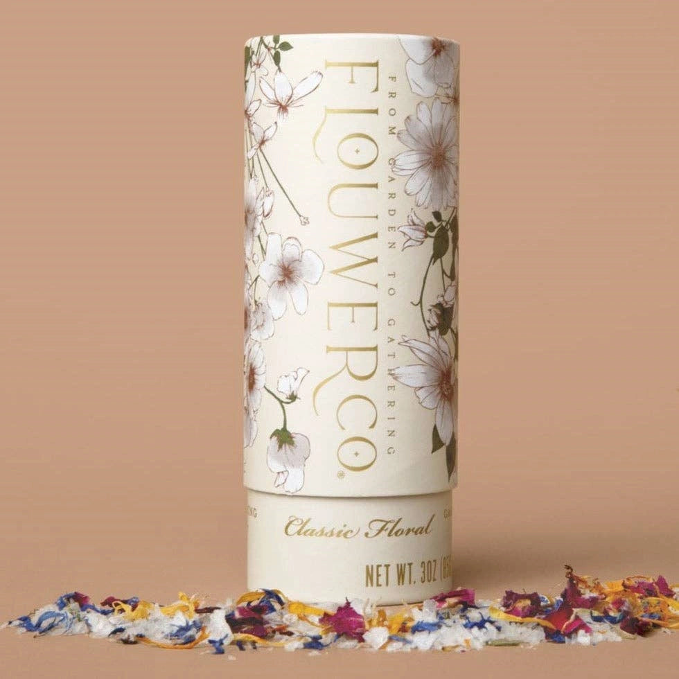 Flower Co. garnishing salt product packaging with floral design on a beige background