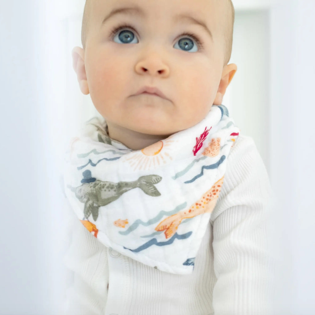 From Campanula Design Studio: Narwhals and Rainbows bibs - Catch some drool or simply style up an outfit with these adorable cotton muslin bandana bibs. Choose from Narwhal, Rainbows, or if you cannot decide,,, both.