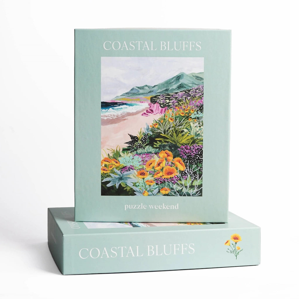 Coastal Bluffs puzzle packaging with nature-themed illustration on a light green background
