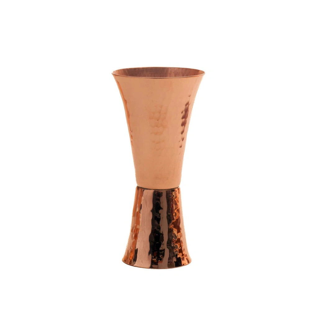 From Campanula Design Studio: Sertodo Copper Double Sided Copper Jigger.  Elegant hourglass shape copper jigger with precise measurements punched into the body. 2 ounce and 1 ounce cups soldered together, with 3/4, 1 1/2 ounce and 1/4, 1/2 ounce indentations struck into each cup for an accurate pour.