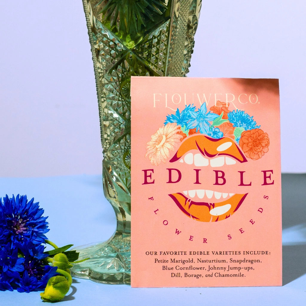 Edible flower seeds packet with a colorful design on a blue background