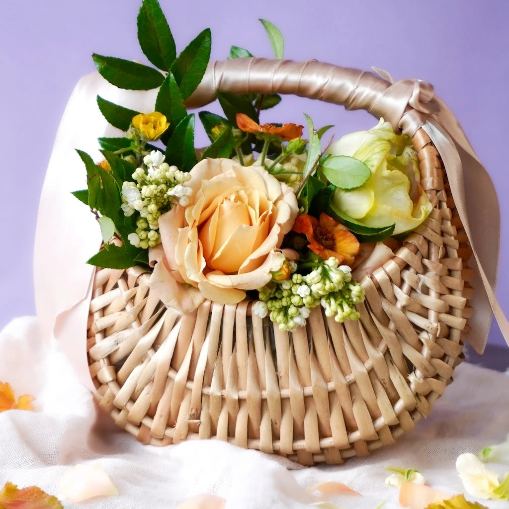 Flower girl basket of flowers, perfect for weddings.