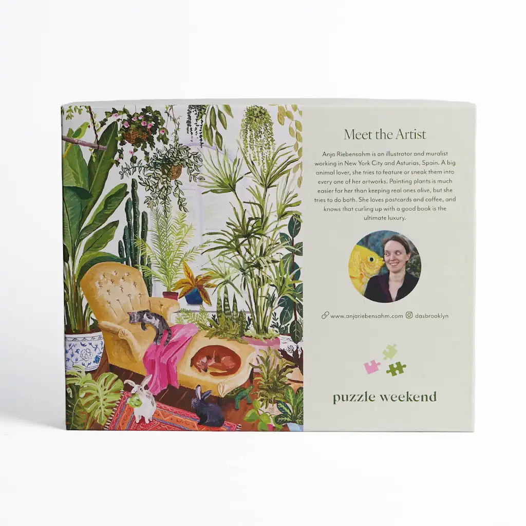 Anja Riebensahm illustrates a haven of houseplants growing in a beautiful sunroom. As you piece together this serene 1000 piece puzzle by Puzzle Weekend, can you spot all six animals featured in the artwork?  Available from Campanula Design Studio, Seattle florist and gift basket company for individual sale, or add it to one of our flower arrangements, gift baskets, or houseplants for the perfect gift.
