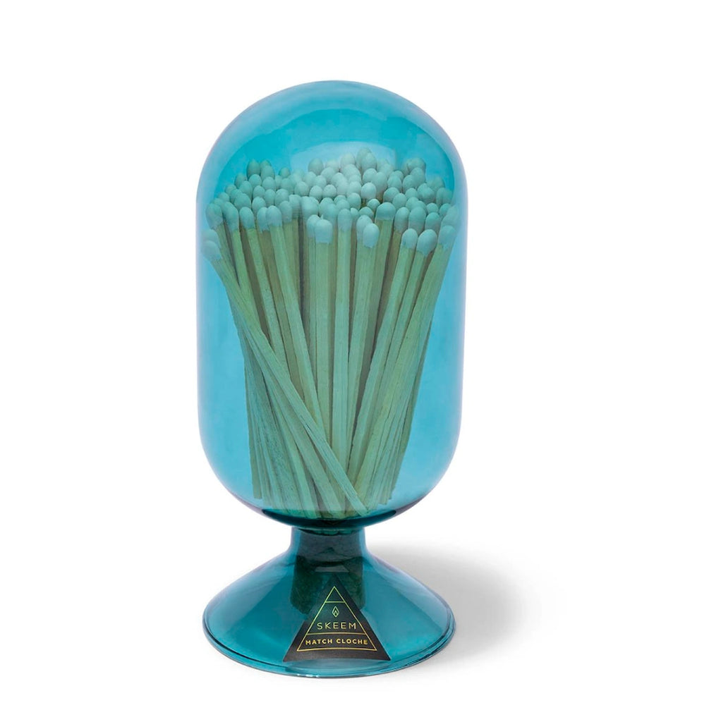 From Campanula Design Studio: Inspired by vintage glass domes used to protect seedlings, these Match Cloches are made of handblown glass and fitted with a cork to shold an assortment of matchsticks. A striker flint on the glass adds functionality. Choose from apricot or teal glass. 