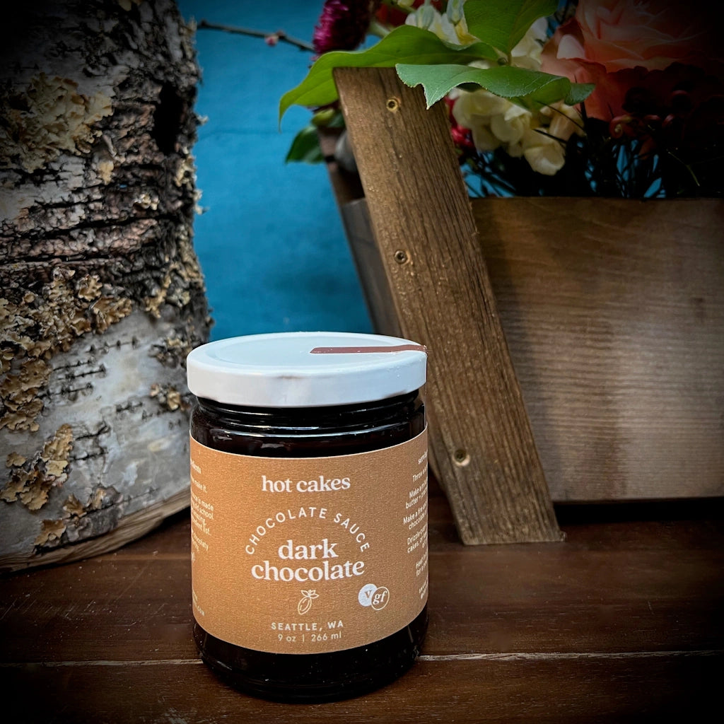 Hot Cakes Dark Chocolate Sauce is available as an add-on to gift baskets from Campanula Design Studio in Seattle or as a stand-alone product.