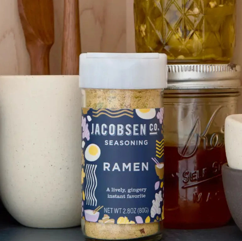 Jar of Jacobsen Co. Ramen seasoning with kitchen items in the background