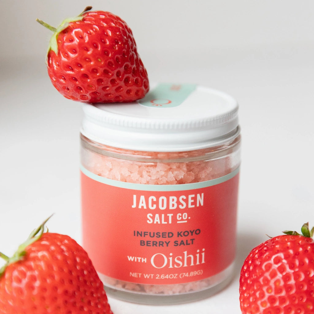 Jar of Jacobsen Salt Co. infused koyo berry salt with strawberries on a white background