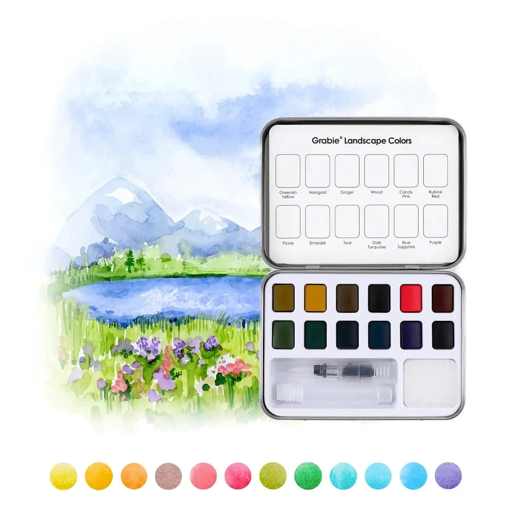 Watercolor paint set with a landscape illustration on a white background