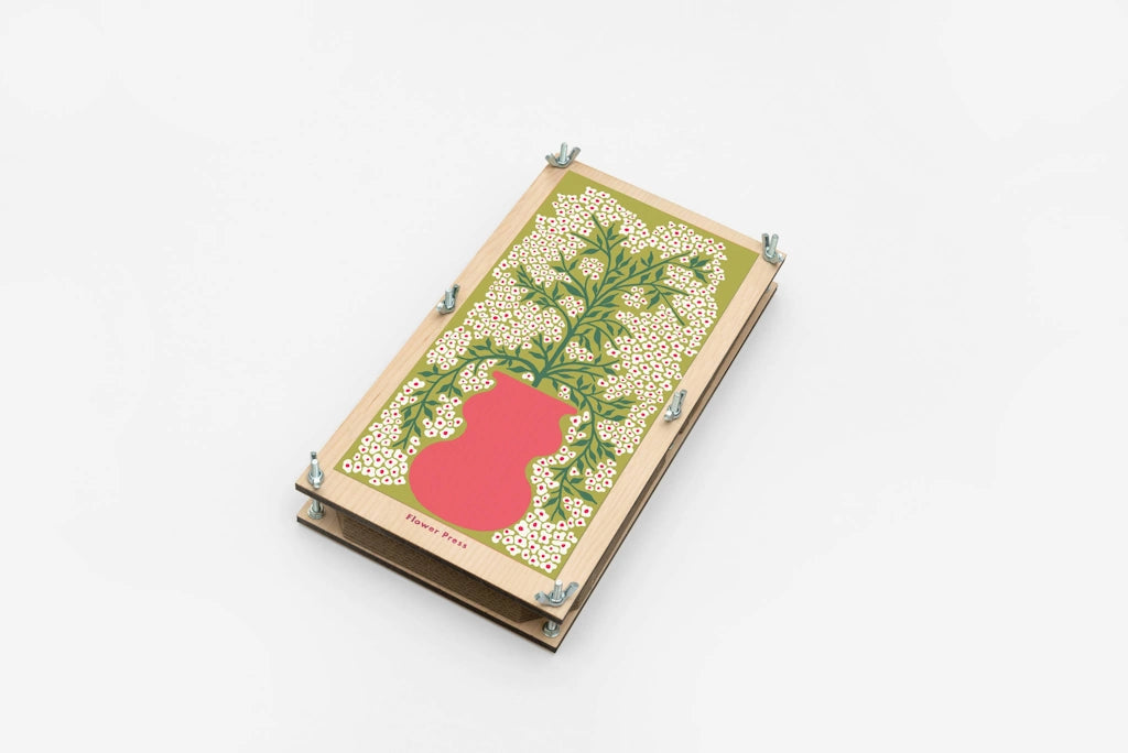 Wooden box featuring a flower press with a decorative lid featuring a red vase or pot and green leaves on a white background. Available for sale from Campanula Design Studio, Seattle florist and gift basket company in the Magnolia neighborhood.