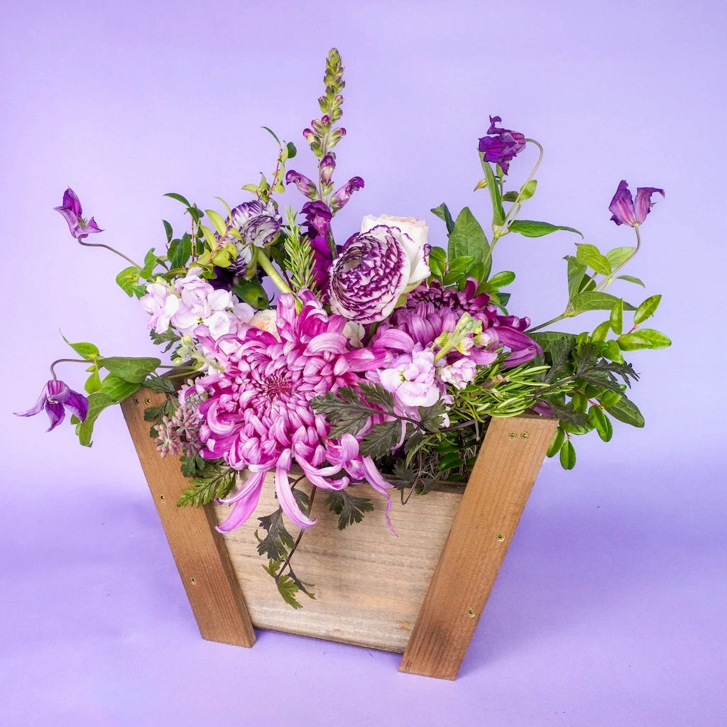 This floral gift basket is perfect for the holidays as a gift for as a bright decoration for your holidays.
