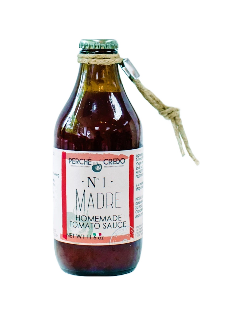 Bottle of Perche Crede Madre Homemade Tomato Sauce on a white background
