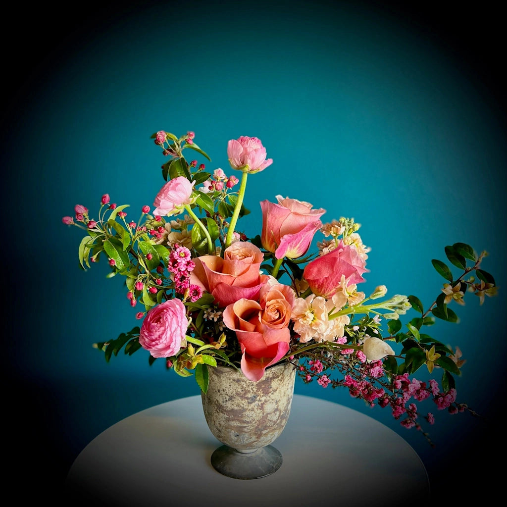 Available from Campanula Design Studio, Mama Said (There'd be Days Like This) is a flora arrangement featuring a monochromatic design of pinks in a pedestal vase.