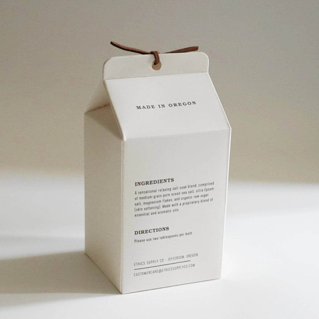 White cardboard box with text on a light background