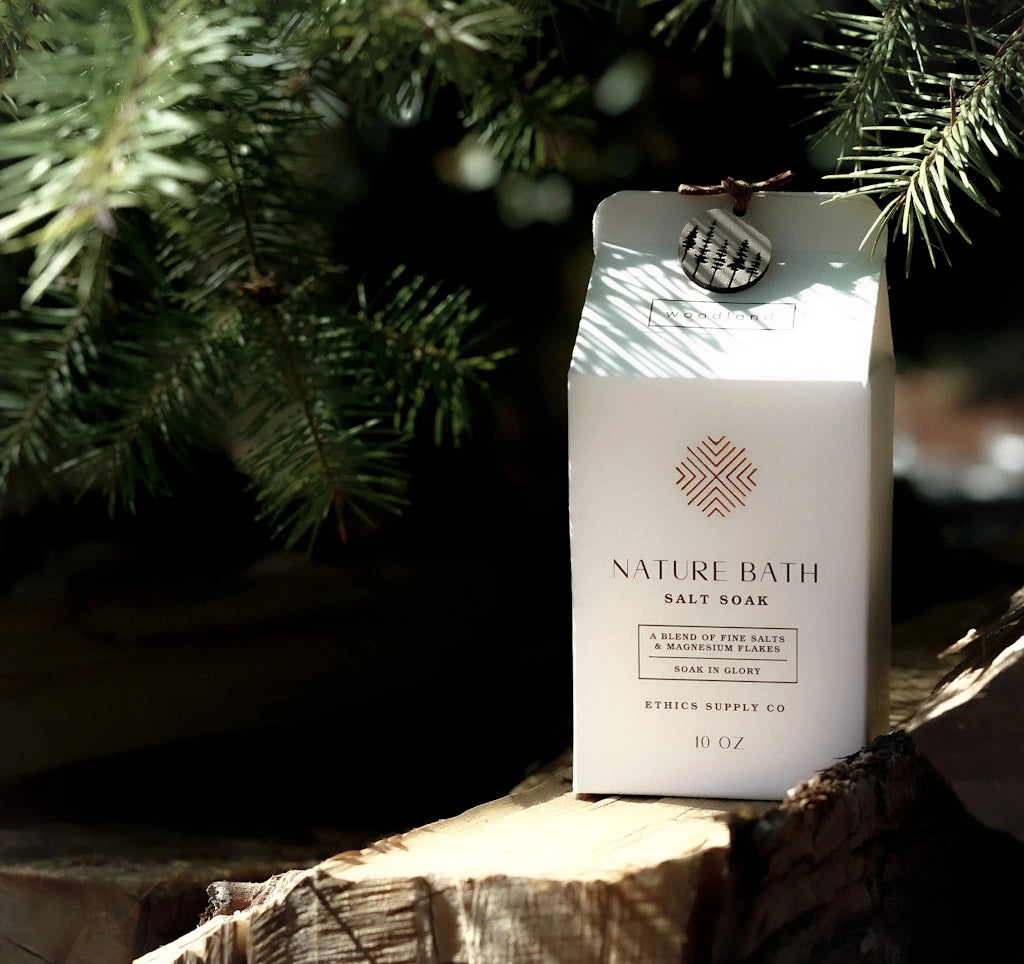 Nature Bath salt soap packaging with a Christmas tree in the background