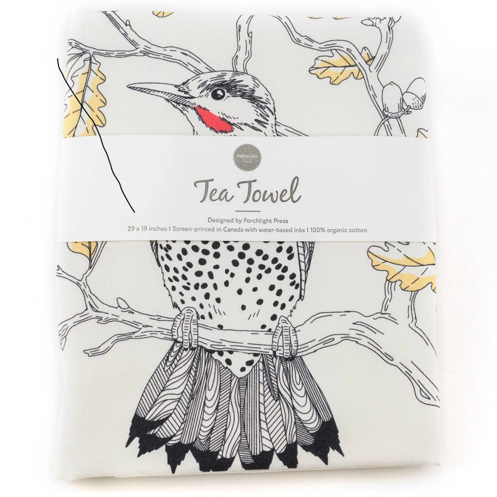 This tea towel showcases an intricately detailed Northern Flicker in a deciduous Oak tree setting. 
This tea towel makes a great upgrade to go with your Seattle flower delivery, gift basket, houseplant or other gifting option.