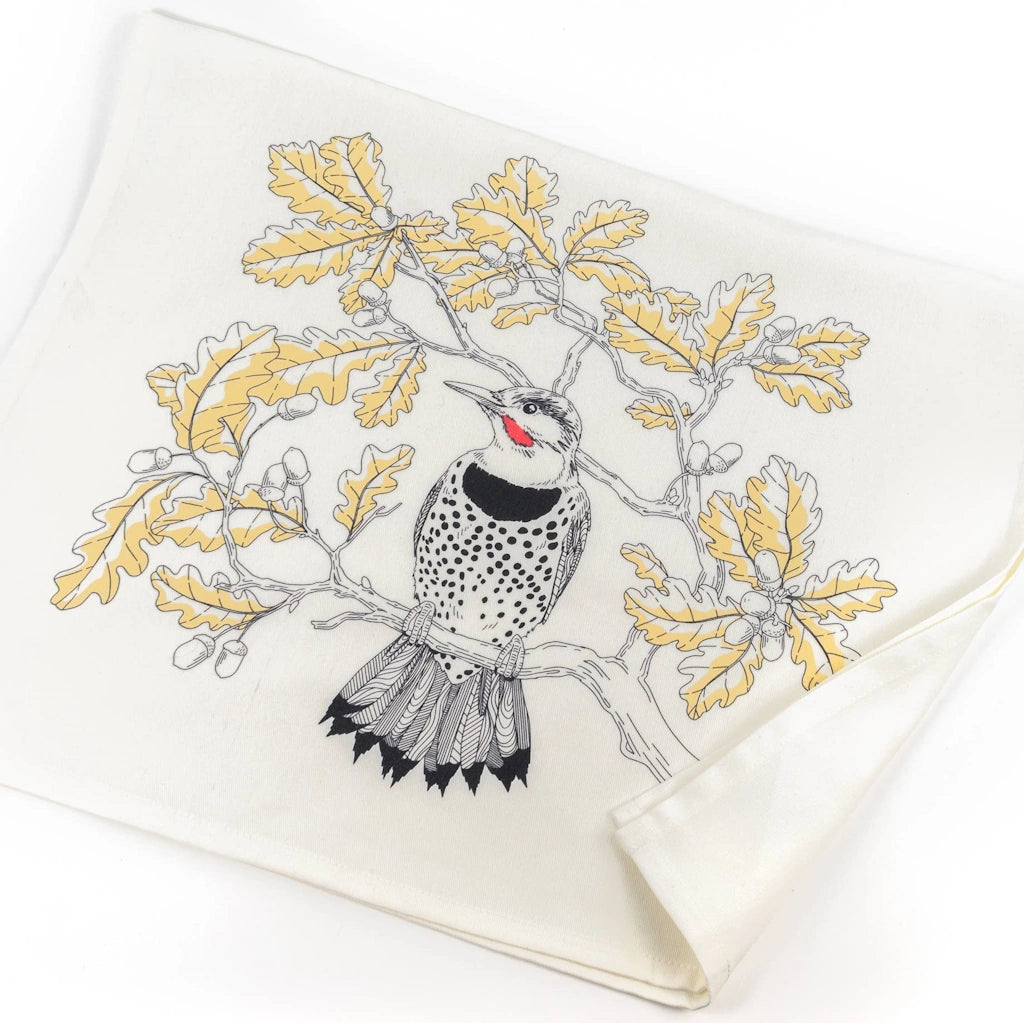 This tea towel showcases an intricately detailed Northern Flicker in a deciduous Oak tree setting. 
This tea towel makes a great upgrade to go with your Seattle flower delivery, gift basket, houseplant or other gifting option.