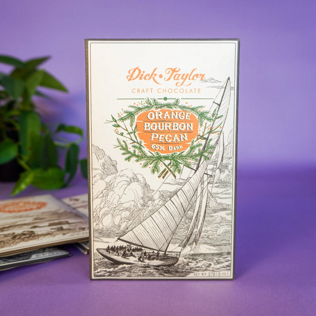 Dick Taylor craft chocolate bar packaging with sailboat illustration on a purple background