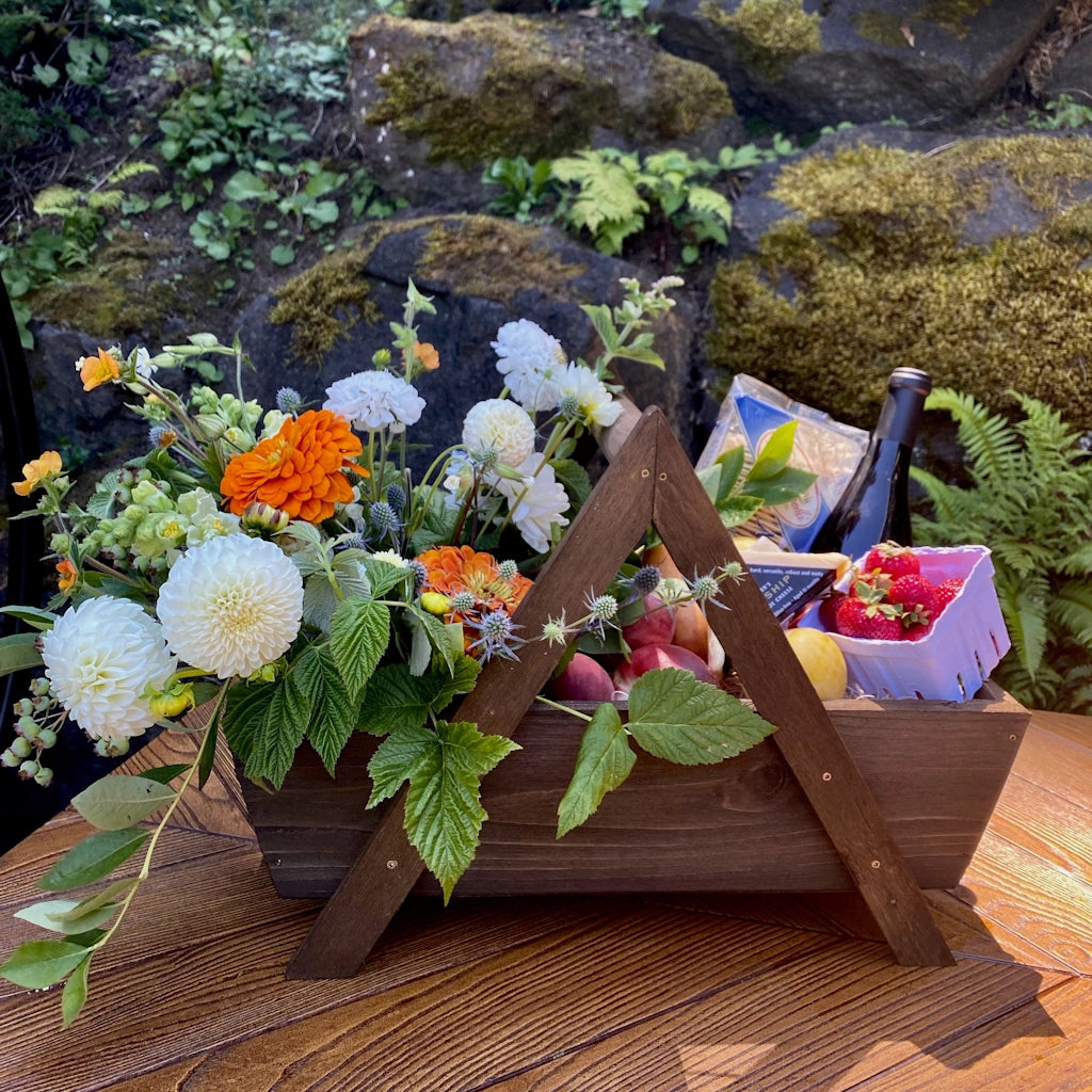 This gift basket from Campanula Design is perfect for those who want to customize their picnic basket and enjoy a picnic and flowers with the love of their life.