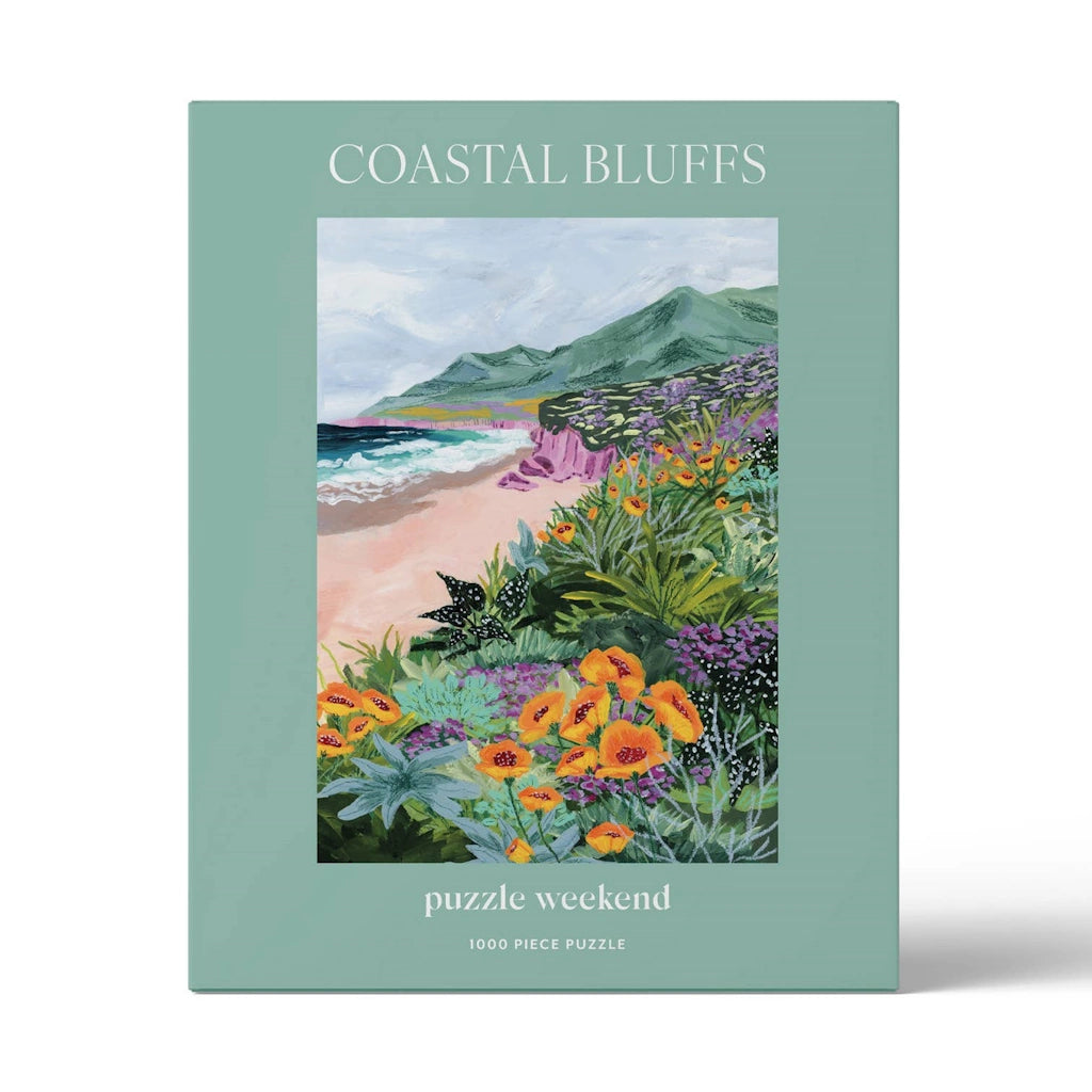 Puzzle box titled 'Coastal Bluffs' with a scenic illustration of a beach and flowers on a light green background.