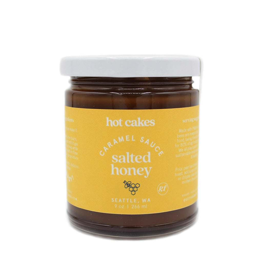 Jar of Hot Cakes salted honey caramel sauce with a yellow label on a white background
