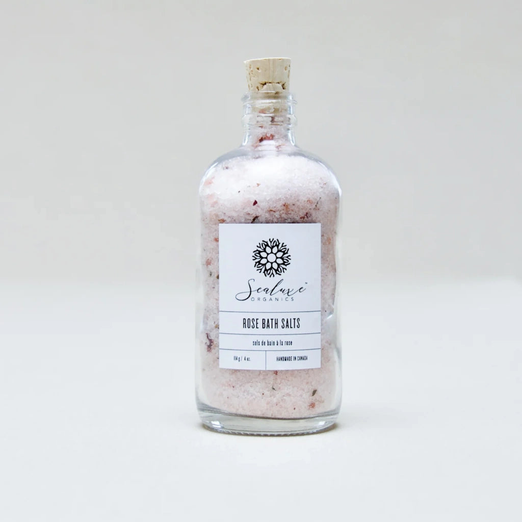 From Campanula Design Studio: Sealuxe Ritual Rose Bath Salts - Indulge in the ultimate pampering experience with luxurious Rose Bath Salts from Sealuxe, presented in a stunning glass bottle that's as beautiful as it is functional. Not only will the delicate fragrance of rose petals fill your bathroom, but you can also reuse the elegant bottle as a decorative piece long after the bath salts are gone.