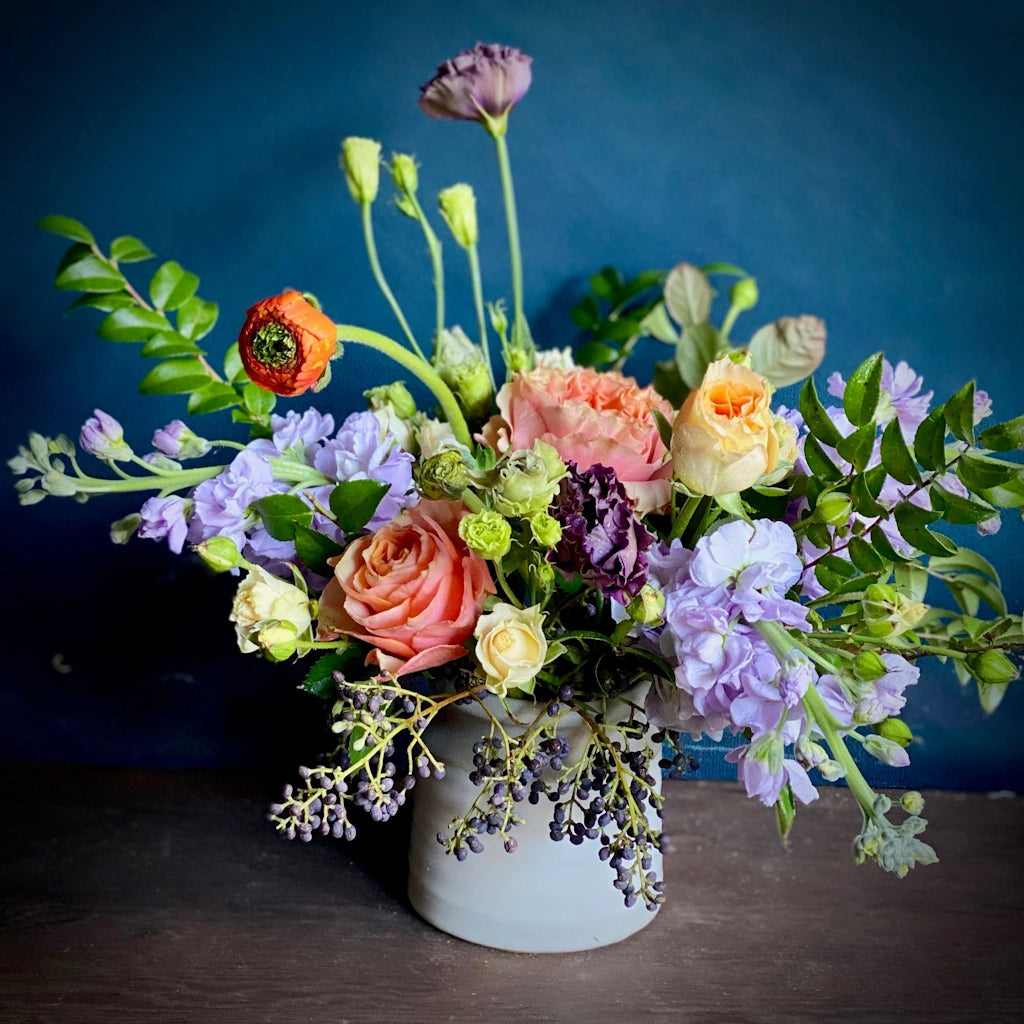 You choose the palette and we'll choose the flowers! A designer's choice arrangement of seasonal flowers in a vase from Campanula Design Studios in Seattle.
