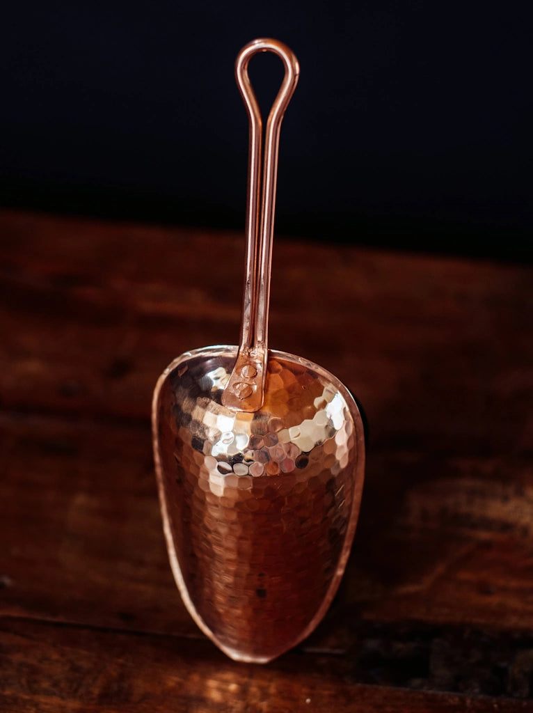 From Campanula Design: Sertodo Copper Ice Scoop - Made of pure copper with a double-riveted stainless steel loop handle, it perfectly complements ice buckets and our other copper barware for effortless entertaining.