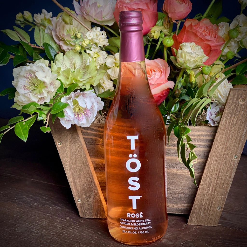 TÖST ROSÉ is a pure and delicious dry sparkling beverage of white tea, white cranberry, and ginger. Equally satisfying as a daily refreshment as it is paired with fine dining, A perfect addition to one of Campanula Design Studio's gift baskets or floral designs.