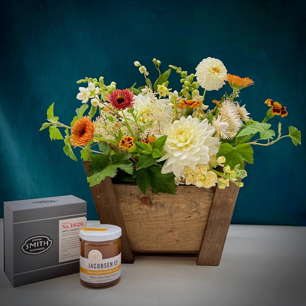 Tea & Honey: A custom handmade wooden gift basket featuring a seasonally inspired floral, Smith Teamaker teas, and Jacobsen Salt Co honey. Designed by Seattle florist Campanula Design Studio.