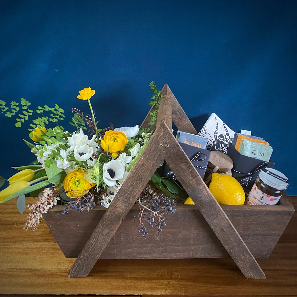 Tea & Honey: A custom handmade wooden gift basket featuring a seasonally inspired floral, Smith Teamaker teas, Jacobsen Salt Co honey, and a sweet tea towel. Designed by Seattle florist Campanula Design Studio.