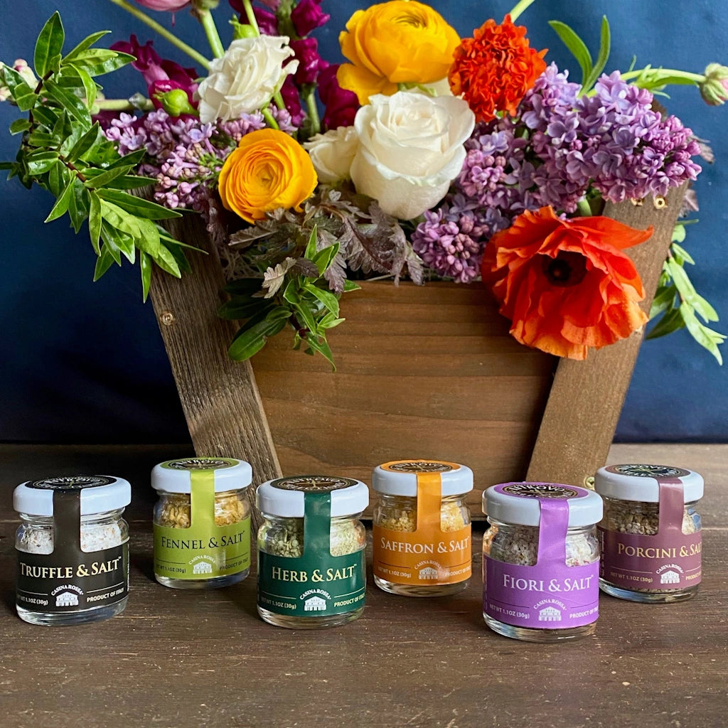 A gift set of six flavored Salts of Italy - truffle & salt, fennel & salt, saffron & salt, fiori & salt, porcini & salt, and herb & salt - delivered to the greater Seattle area with a handmade gift basket featuring a beautiful seasonal floral arrangement.