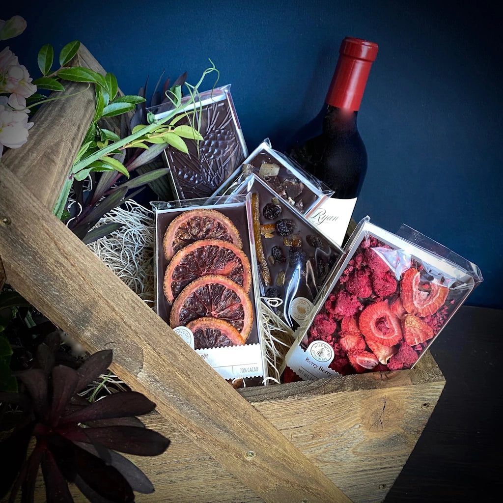 A luxurious basket of premium chocolate bars from Wildwood Chocolate of Portland and wine from Mark Ryan winery. Choose your favorite bottle of red, white, rose or bubbles and indulge in five beautiful and artistic bars of chocolate.