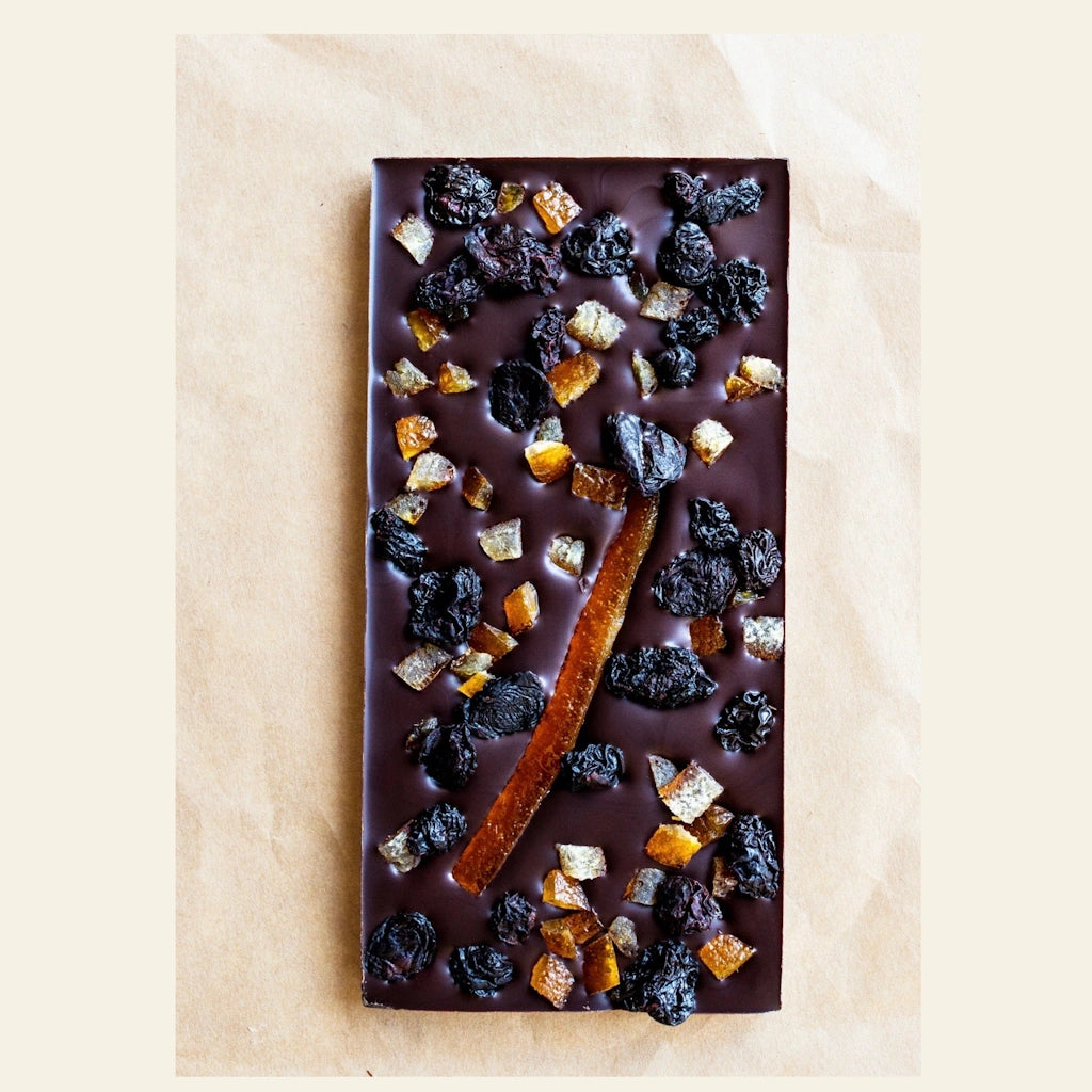 Wildwood Chocolate Bar - Orange Confit and Cherries - Sweet orange confit pairs in delicate balance with tart dried cherries making this duo a supreme match over rich 70% dark chocolate. 