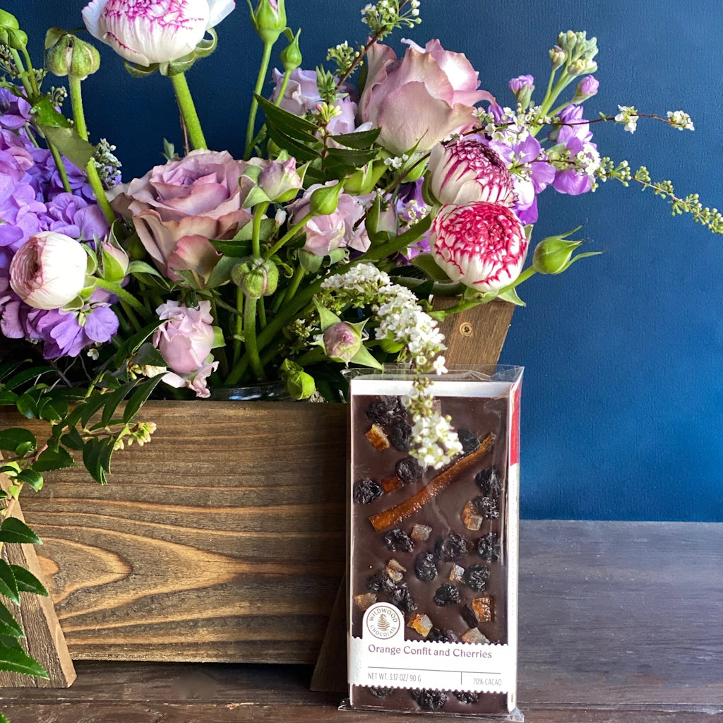 Handcrafted chocolate bar, featuring sweet floral orange confit in delicate balance with tart dried cherries making this duo a supreme match over rich 70% dark chocolate.