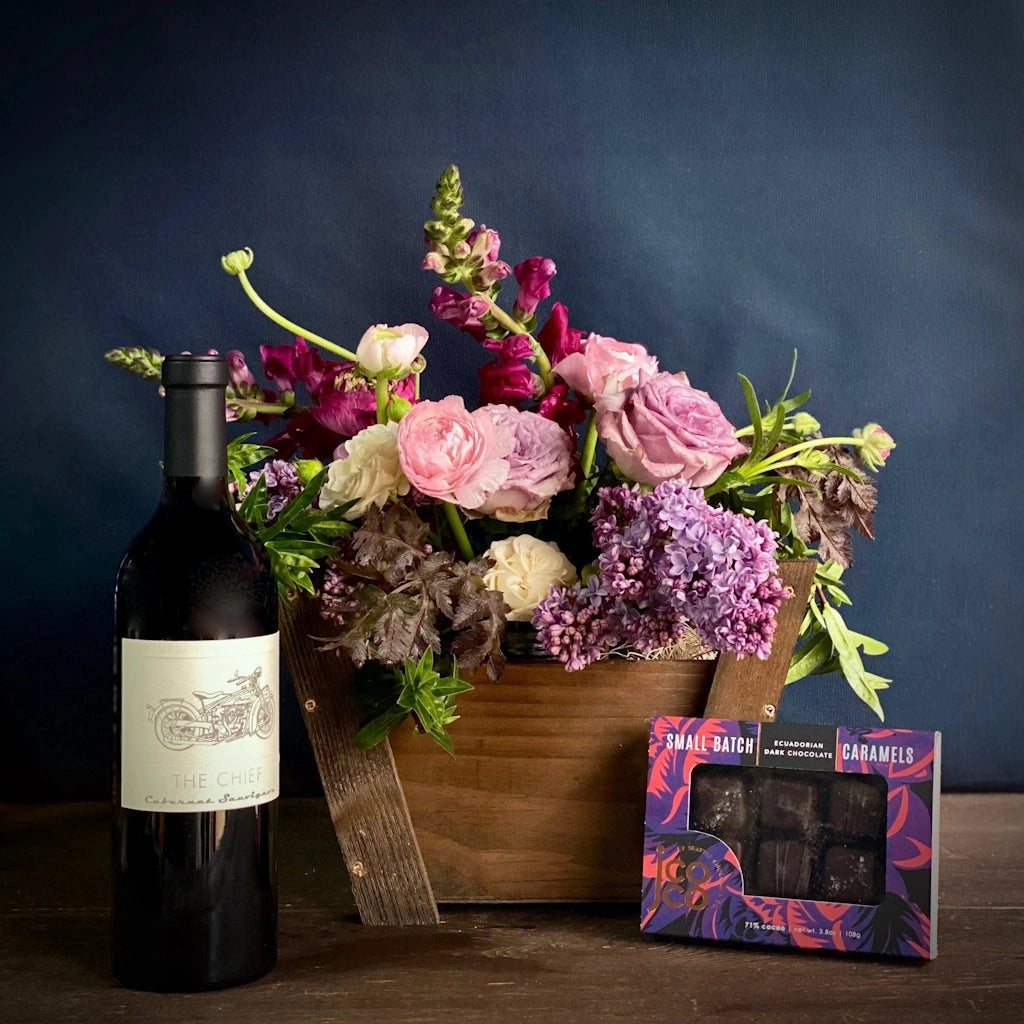 For delivery in the greater Seattle area, this gift basket features a bottle of Mark Ryan Winery wine and your choice of chocolate treat: a set of 6 Jcoco mini bars in assorted flavors - 3 milk and 3 dark, a set of two Mission chocolate bars (our choice of flavors), or a box of Wildwood Chocolate Texas Pecan Brittle.